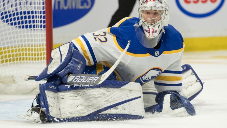 Jan 18, 2022; Ottawa, Ontario, CAN; Buffalo Sabres goalie Michael Houser (32) defends the goal in the second period against the Ottawa Senators at the Canadian Tire Centre. Mandatory Credit: Marc DesRosiers-USA TODAY Sports