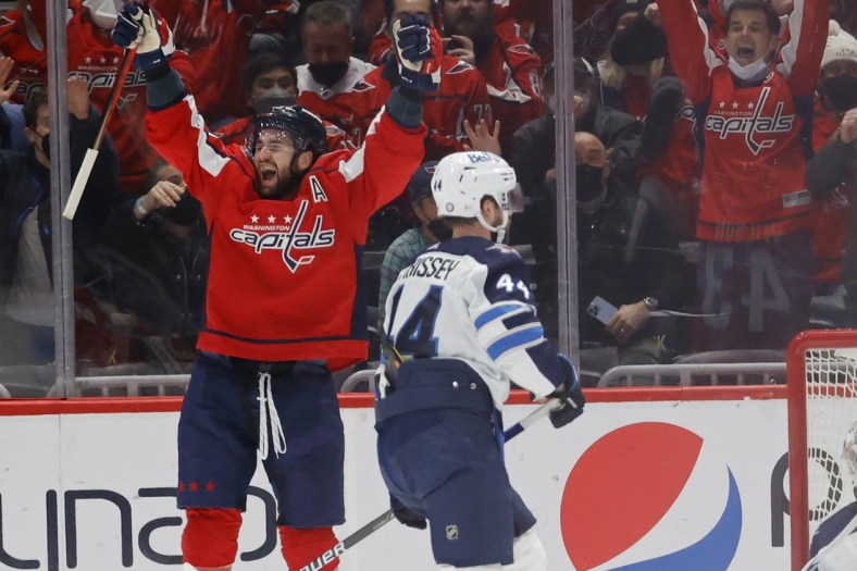 Jan 18, 2022; Washington, District of Columbia, USA; Washington Capitals right wing Tom Wilson (43) celebrates after scoring the game-winning goal against the Winnipeg Jets in overtime at Capital One Arena. Mandatory Credit: Geoff Burke-USA TODAY Sports