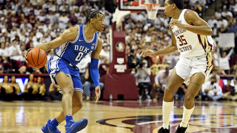 Jan 18, 2022; Tallahassee, Florida, USA; Duke Blue Devils guard Wendell Moore Jr (0) looks to pass the ball against Florida State Seminoles guard Matthew Cleveland (35) during the first half at Donald L. Tucker Center. Mandatory Credit: Melina Myers-USA TODAY Sports