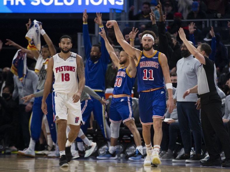 Jan 18, 2022; San Francisco, California, USA; Golden State Warriors guard Klay Thompson (11) reacts after making a three-point basket over Detroit Pistons guard Cory Joseph (18) during the second quarter at Chase Center. Mandatory Credit: D. Ross Cameron-USA TODAY Sports
