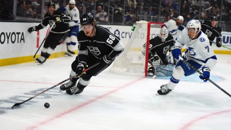 Jan 18, 2022; Los Angeles, California, USA; LA Kings left wing Samuel Fagemo (68) skates with the puck against Tampa Bay Lightning right wing Mathieu Joseph (7) in the first period at Crypto.com Arena. Mandatory Credit: Kirby Lee-USA TODAY Sports