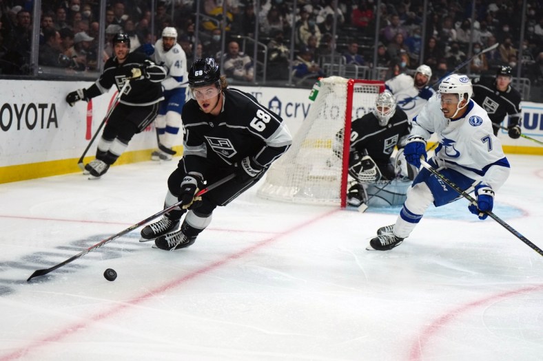 Jan 18, 2022; Los Angeles, California, USA; LA Kings left wing Samuel Fagemo (68) skates with the puck against Tampa Bay Lightning right wing Mathieu Joseph (7) in the first period at Crypto.com Arena. Mandatory Credit: Kirby Lee-USA TODAY Sports