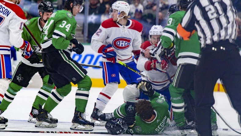 Jan 18, 2022; Dallas, Texas, USA; Montreal Canadiens left wing Jonathan Drouin (92) draws a game misconduct major for a cross check on Dallas Stars center Tyler Seguin (91) during the third period at the American Airlines Center. Mandatory Credit: Jerome Miron-USA TODAY Sports