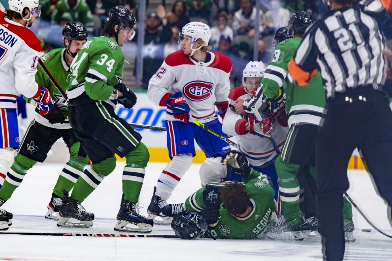 Jan 18, 2022; Dallas, Texas, USA; Montreal Canadiens left wing Jonathan Drouin (92) draws a game misconduct major for a cross check on Dallas Stars center Tyler Seguin (91) during the third period at the American Airlines Center. Mandatory Credit: Jerome Miron-USA TODAY Sports