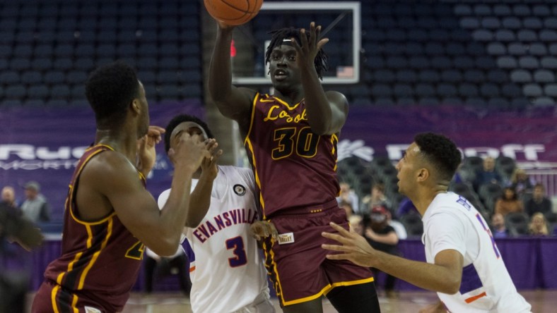 Loyola Chicago's Aher Uguak (30) passes to Chris Knight (23) as the Loyola Chicago Ramblers play the University of Evansville Purple Aces at Ford Center in Evansville, Ind., Tuesday evening, Jan. 18, 2022. Loyola Chicago won 77-48.

Mb 01182022 Uevsloyola 43