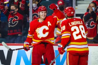 Jan 18, 2022; Calgary, Alberta, CAN; Calgary Flames left wing Matthew Tkachuk (19) scores a goal with center Elias Lindholm (28) against the Florida Panthers during the third period at Scotiabank Saddledome. Mandatory Credit: Sergei Belski-USA TODAY Sports