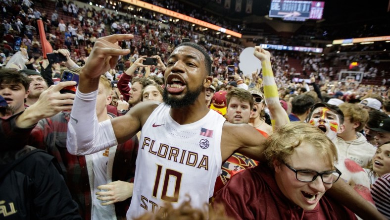 Florida State Seminoles forward Malik Osborne (10) celebrates with fanswho stormed the court after the Seminoles defeated the Duke Blue Devils 79-78 in overtime at the Donald L. Tucker Civic Center on Tuesday, Jan. 18, 2022.

Fsu V Duke Second Half1290