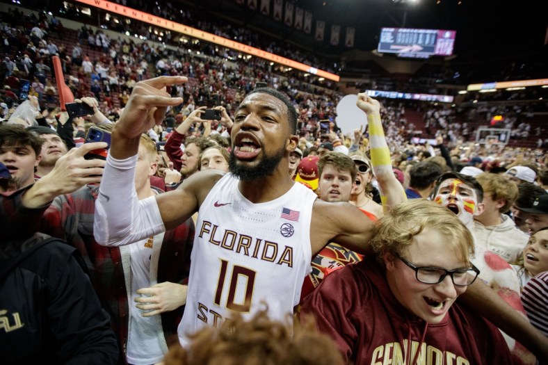 Florida State Seminoles forward Malik Osborne (10) celebrates with fanswho stormed the court after the Seminoles defeated the Duke Blue Devils 79-78 in overtime at the Donald L. Tucker Civic Center on Tuesday, Jan. 18, 2022.

Fsu V Duke Second Half1290