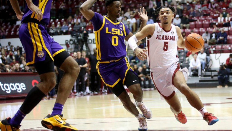 Alabama guard Jaden Shackelford (5) drives into the lane past LSU guard Brandon Murray (0) in Coleman Coliseum on the campus of the University of Alabama Wednesday, Jan. 19, 2022.

Sec Men S Basketball Alabama Vs Lsu