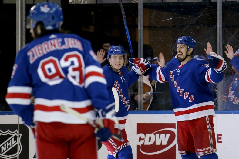 Jan 19, 2022; New York, New York, USA; New York Rangers left wing Chris Kreider (20) celebrates his goal against the Toronto Maple Leafs with right wing Kaapo Kakko (24) and center Mika Zibanejad (93) during the third period at Madison Square Garden. Mandatory Credit: Brad Penner-USA TODAY Sports
