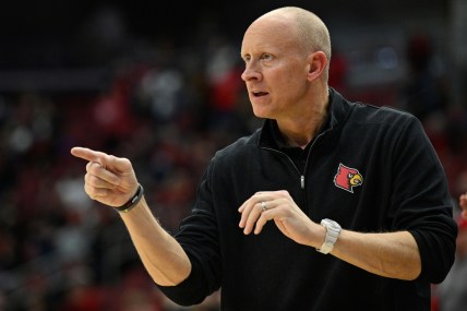 Jan 12, 2022; Louisville, Kentucky, USA;  Louisville Cardinals head coach Chris Mack gives instructions during the second half against the North Carolina State Wolfpack at KFC Yum! Center. N.C. State defeated Louisville 79-63. Mandatory Credit: Jamie Rhodes-USA TODAY Sports