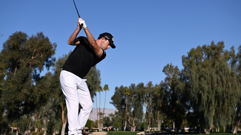 Jan 20, 2022; La Quinta, California, USA; Patrick Cantlay plays his shot from the 15th tee during the first round of the American Express golf tournament at La Quinta Country Club. Mandatory Credit: Orlando Ramirez-USA TODAY Sports