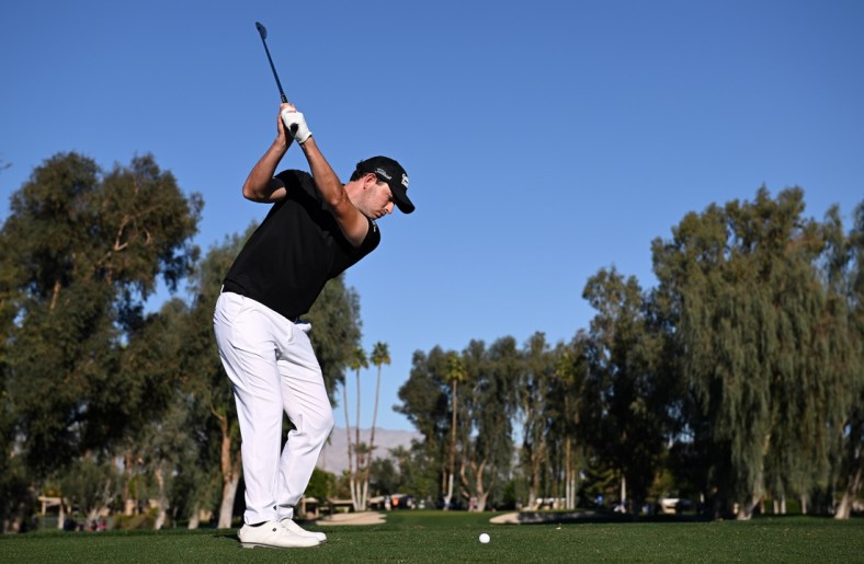 Jan 20, 2022; La Quinta, California, USA; Patrick Cantlay plays his shot from the 15th tee during the first round of the American Express golf tournament at La Quinta Country Club. Mandatory Credit: Orlando Ramirez-USA TODAY Sports