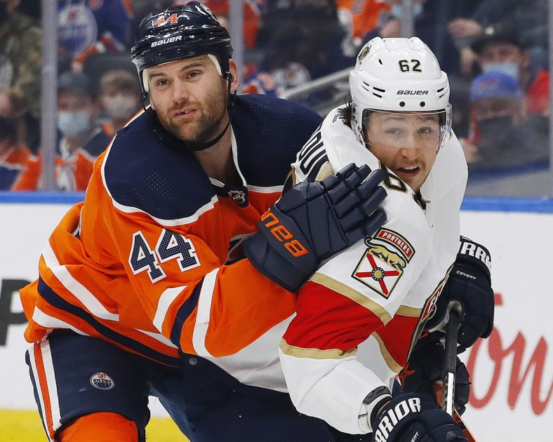 Jan 20, 2022; Edmonton, Alberta, CAN; Edmonton Oilers forward Zack Kassian (44) and Florida Panthers defensemen Brandon Montour (62) battle for position during the first period at Rogers Place. Mandatory Credit: Perry Nelson-USA TODAY Sports