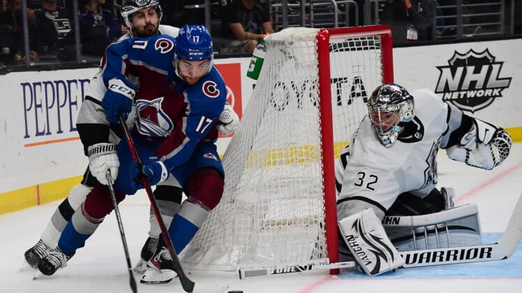 Jan 20, 2022; Los Angeles, California, USA; Colorado Avalanche center Tyson Jost (17) moves in for a shot on goal against Los Angeles Kings goaltender Jonathan Quick (32) and center Phillip Danault (24) during the third period at Crypto.com Arena. Mandatory Credit: Gary A. Vasquez-USA TODAY Sports