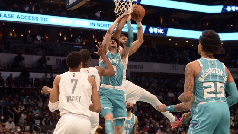 Jan 21, 2022; Charlotte, North Carolina, USA;  Charlotte Hornets guard LaMelo Ball (2) fights for a rebound during the first half against the Oklahoma City Thunder at The Spectrum Center. Mandatory Credit: Sam Sharpe-USA TODAY Sports