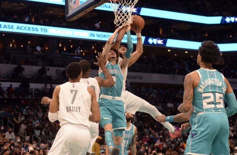 Jan 21, 2022; Charlotte, North Carolina, USA;  Charlotte Hornets guard LaMelo Ball (2) fights for a rebound during the first half against the Oklahoma City Thunder at The Spectrum Center. Mandatory Credit: Sam Sharpe-USA TODAY Sports