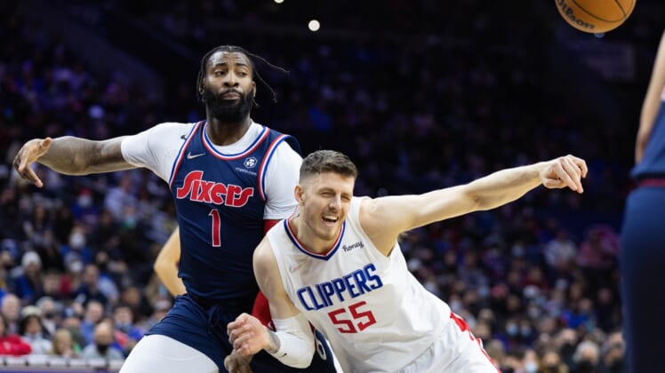 Jan 21, 2022; Philadelphia, Pennsylvania, USA; LA Clippers center Isaiah Hartenstein (55) loses control of the ball while driving against Philadelphia 76ers center Andre Drummond (1) during the second quarter at Wells Fargo Center. Mandatory Credit: Bill Streicher-USA TODAY Sports