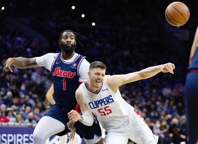 Jan 21, 2022; Philadelphia, Pennsylvania, USA; LA Clippers center Isaiah Hartenstein (55) loses control of the ball while driving against Philadelphia 76ers center Andre Drummond (1) during the second quarter at Wells Fargo Center. Mandatory Credit: Bill Streicher-USA TODAY Sports