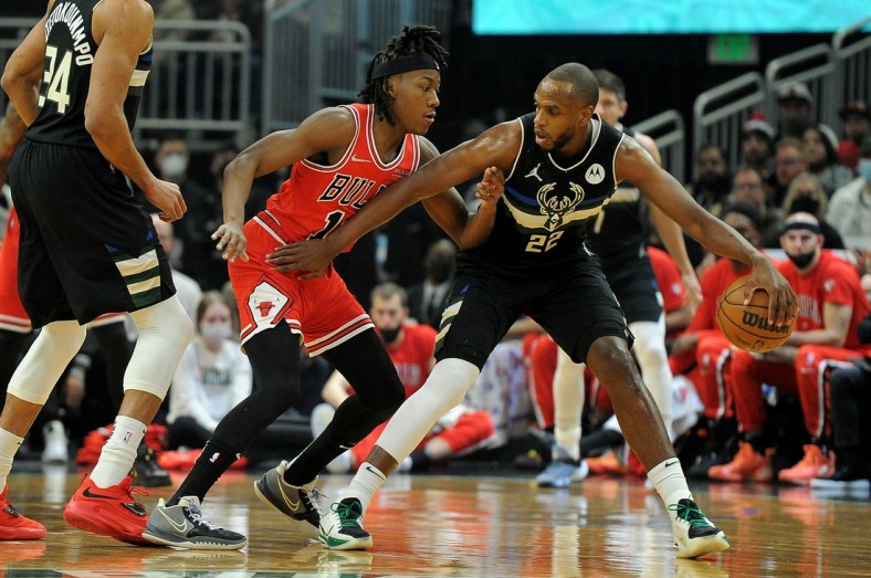 Jan 21, 2022; Milwaukee, Wisconsin, USA;  Milwaukee Bucks forward Khris Middleton (22) is guarded by Chicago Bulls guard Ayo Dosunmu (12) in the first half at Fiserv Forum. Mandatory Credit: Michael McLoone-USA TODAY Sports
