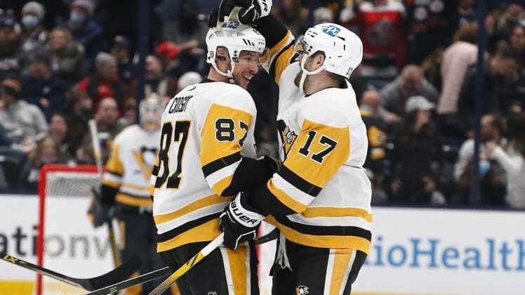 Jan 21, 2022; Columbus, Ohio, USA; Pittsburgh Penguins center Sidney Crosby (87) celebrates his hat trick during the third period against the Columbus Blue Jackets at Nationwide Arena. Mandatory Credit: Russell LaBounty-USA TODAY Sports