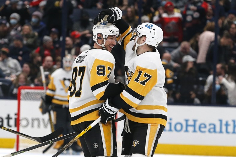 Jan 21, 2022; Columbus, Ohio, USA; Pittsburgh Penguins center Sidney Crosby (87) celebrates his hat trick during the third period against the Columbus Blue Jackets at Nationwide Arena. Mandatory Credit: Russell LaBounty-USA TODAY Sports