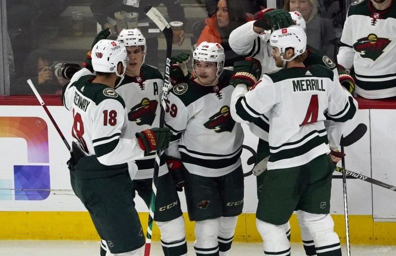 Jan 21, 2022; Chicago, Illinois, USA; Minnesota Wild defenseman Calen Addison (59) celebrates his goal against the Chicago Blackhawks during the second period at United Center. Mandatory Credit: David Banks-USA TODAY Sports