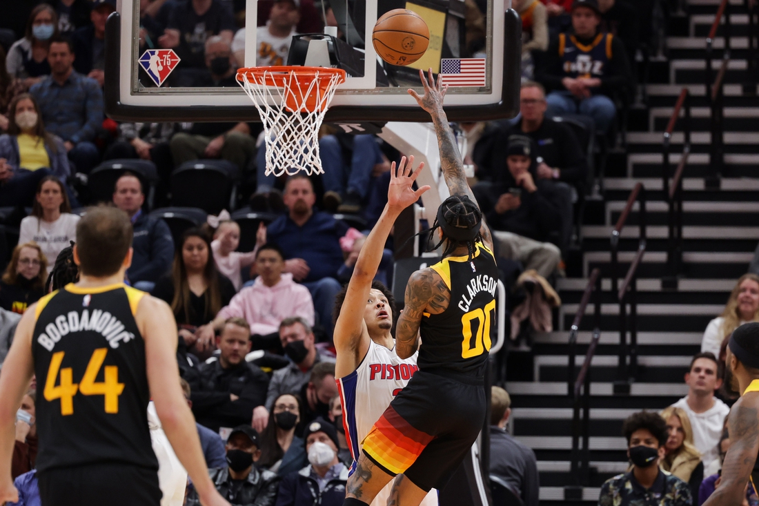 Jan 21, 2022; Salt Lake City, Utah, USA;  Utah Jazz guard Jordan Clarkson (00) pushes the ball past Detroit Pistons guard Cade Cunningham (2) and to the basket during the second quarter at Vivint Arena. Mandatory Credit: Chris Nicoll-USA TODAY Sports