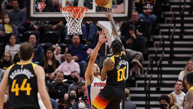 Jan 21, 2022; Salt Lake City, Utah, USA;  Utah Jazz guard Jordan Clarkson (00) pushes the ball past Detroit Pistons guard Cade Cunningham (2) and to the basket during the second quarter at Vivint Arena. Mandatory Credit: Chris Nicoll-USA TODAY Sports