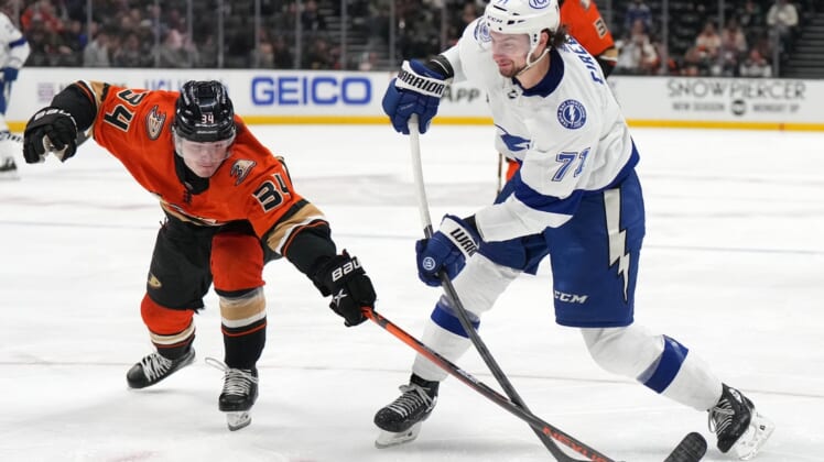 Jan 21, 2022; Anaheim, California, USA; Tampa Bay Lightning center Anthony Cirelli (71) shoots in front of Anaheim Ducks defenseman Jamie Drysdale (34) in the second period at Honda Center. Mandatory Credit: Kirby Lee-USA TODAY Sports