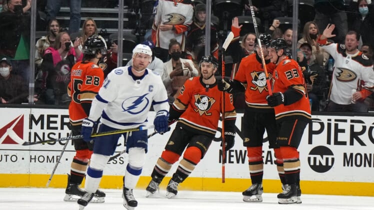 Jan 21, 2022; Anaheim, California, USA; Anaheim Ducks center Derek Grant (38) celebrates with teammates defenseman Kevin Shattenkirk (22), center Derek Grant (38) and right wing Jakob Silfverberg (33) after scoring a goal against the Tampa Bay Lightning  in the second period at Honda Center. Mandatory Credit: Kirby Lee-USA TODAY Sports