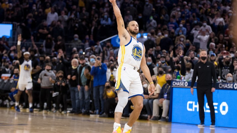 Jan 21, 2022; San Francisco, California, USA;  Golden State Warriors guard Stephen Curry (30) celebrates after making the game-winning shot in the last seconds of the second half of the game against the Houston Rockets at Chase Center. Mandatory Credit: John Hefti-USA TODAY Sports