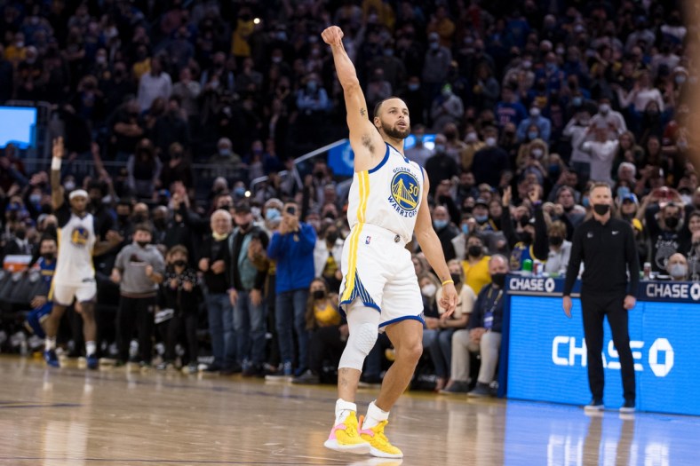 Jan 21, 2022; San Francisco, California, USA;  Golden State Warriors guard Stephen Curry (30) celebrates after making the game-winning shot in the last seconds of the second half of the game against the Houston Rockets at Chase Center. Mandatory Credit: John Hefti-USA TODAY Sports