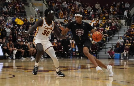 Jan 22, 2022; Chicago, Illinois, USA; Loyola (Il) Ramblers forward Aher Uguak (30) defends Missouri State Bears guard Isiaih Mosley (1) during the first half at Joseph J. Gentile Arena. Mandatory Credit: David Banks-USA TODAY Sports