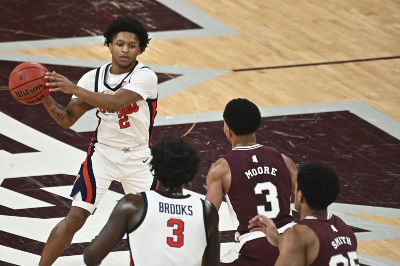 Jan 22, 2022; Starkville, Mississippi, USA;Mississippi Rebels guard Daeshun Ruffin (2) handles the ball while defended by Mississippi State Bulldogs guard Shakeel Moore (3) during the first half at Humphrey Coliseum. Mandatory Credit: Matt Bush-USA TODAY Sports