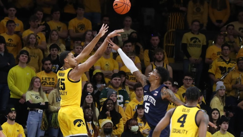 Jan 22, 2022; Iowa City, Iowa, USA; Iowa Hawkeyes forward Keegan Murray (15) shoots over the hands of Penn State Nittany Lions forward Greg Lee (5) at Carver-Hawkeye Arena. Mandatory Credit: Reese Strickland-USA TODAY Sports