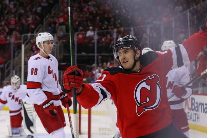 Jan 22, 2022; Newark, New Jersey, USA; New Jersey Devils center Michael McLeod (20) celebrates after scoring a goal against the Carolina Hurricanes during the second period at Prudential Center. Mandatory Credit: Ed Mulholland-USA TODAY Sports
