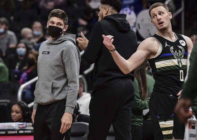 Jan 22, 2022; Milwaukee, Wisconsin, USA;  Milwaukee Bucks guard Grayson Allen (left) looks on during a game against the Sacramento Kings at Fiserv Forum. Allen did not play. Mandatory Credit: Benny Sieu-USA TODAY Sports