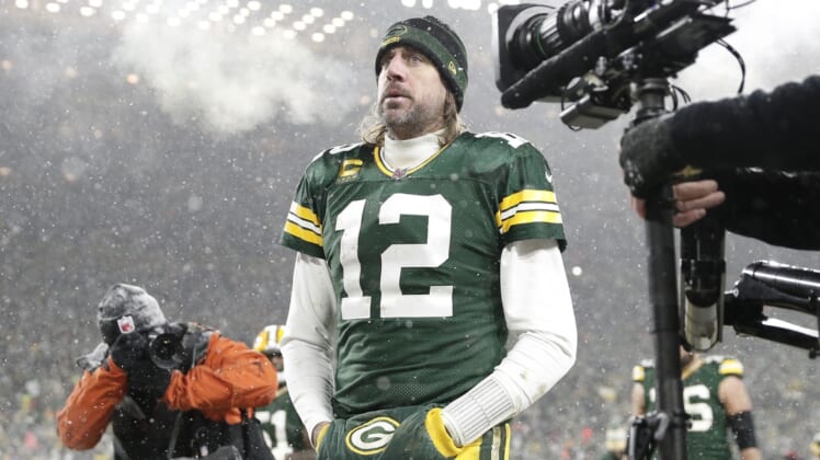 Jan 22, 2022; Green Bay, Wisconsin, USA; Green Bay Packers quarterback Aaron Rodgers (12) reacts while leaving the field after an NFC Divisional playoff football game against the San Francisco 49ers at Lambeau Field. Mandatory Credit: Jeff Hanisch-USA TODAY Sports