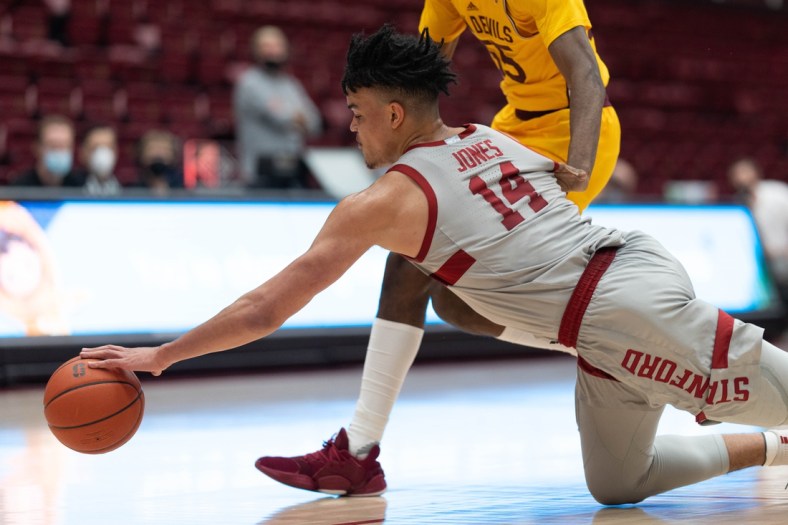 Jan 22, 2022; Stanford, California, USA;  Stanford Cardinal forward Spencer Jones (14) dives for a loose ball during the first half against Arizona State Sun Devils forward Jamiya Neal (55) at Maples Pavilion. Mandatory Credit: Stan Szeto-USA TODAY Sports