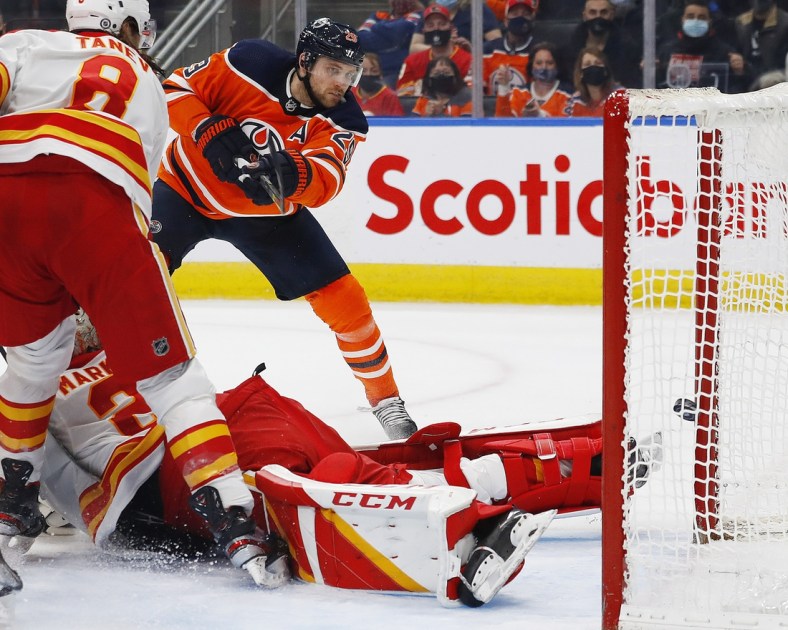 Jan 22, 2022; Edmonton, Alberta, CAN; Edmonton Oilers forward Leon Draisaitl (29) scores a third period goal against Calgary Flames goaltender Jacob Markstrom (25) at Rogers Place. Mandatory Credit: Perry Nelson-USA TODAY Sports