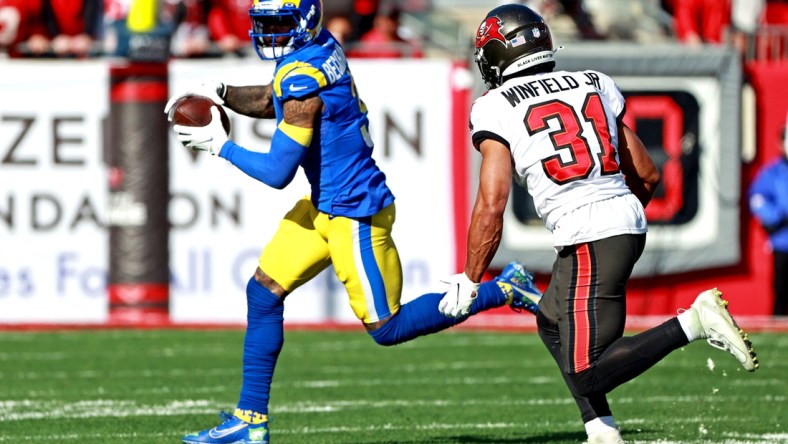 Jan 23, 2022; Tampa, Florida, USA; Los Angeles Rams wide receiver Odell Beckham Jr. (3) run the ball against Tampa Bay Buccaneers safety Antoine Winfield Jr. (31) during the first half in a NFC Divisional playoff football game at Raymond James Stadium. Mandatory Credit: Matt Pendleton-USA TODAY Sports