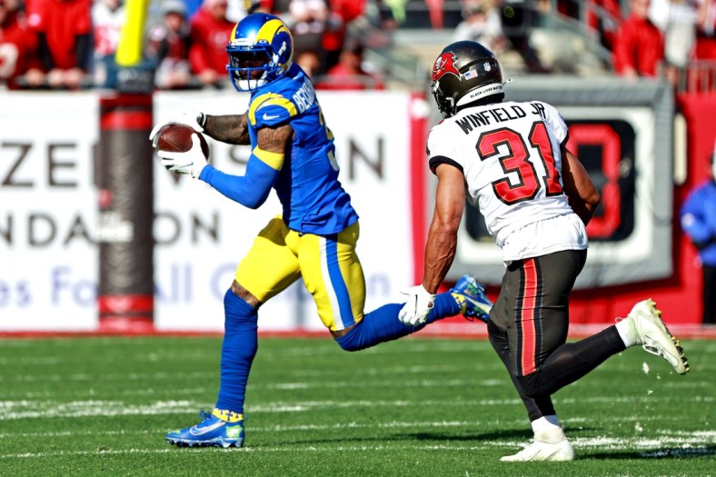 Jan 23, 2022; Tampa, Florida, USA; Los Angeles Rams wide receiver Odell Beckham Jr. (3) run the ball against Tampa Bay Buccaneers safety Antoine Winfield Jr. (31) during the first half in a NFC Divisional playoff football game at Raymond James Stadium. Mandatory Credit: Matt Pendleton-USA TODAY Sports