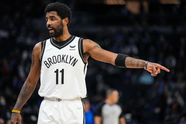 Jan 23, 2022; Minneapolis, Minnesota, USA; Brooklyn Nets guard Kyrie Irving (11) reacts to a call during the first quarter against the Minnesota Timberwolves at Target Center. Mandatory Credit: Brace Hemmelgarn-USA TODAY Sports
