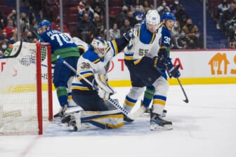 Jan 23, 2022; Vancouver, British Columbia, CAN; St. Louis Blues defenseman Colton Parayko (55) looks on as goalie Ville Husso (35) makes a save against the Vancouver Canucks  in the first period at Rogers Arena. Mandatory Credit: Bob Frid-USA TODAY Sports