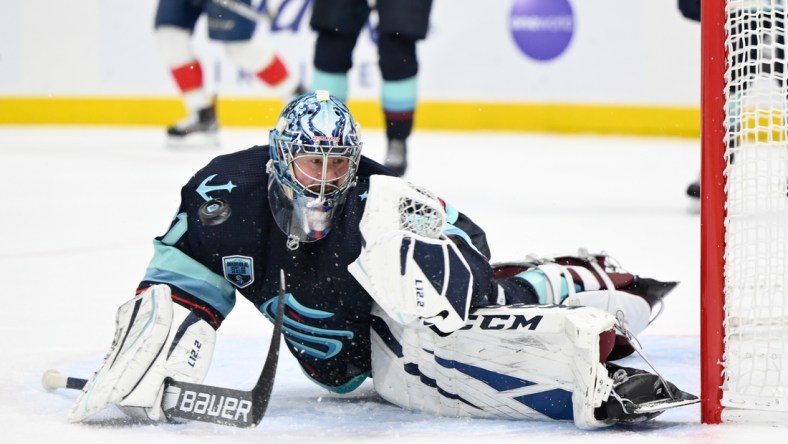 Jan 23, 2022; Seattle, Washington, USA; Seattle Kraken goaltender Philipp Grubauer (31) saves a goal during the third period against the Florida Panthers at Climate Pledge Arena. Seattle defeated Florida 5-3. Mandatory Credit: Steven Bisig-USA TODAY Sports