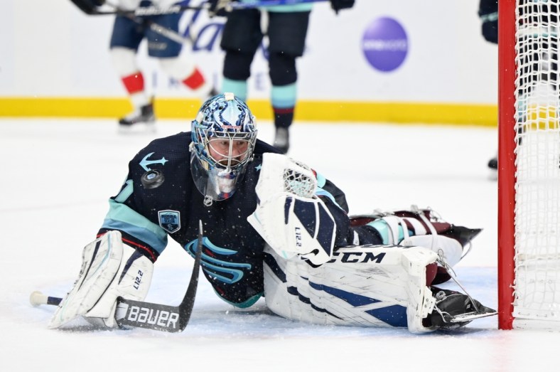 Jan 23, 2022; Seattle, Washington, USA; Seattle Kraken goaltender Philipp Grubauer (31) saves a goal during the third period against the Florida Panthers at Climate Pledge Arena. Seattle defeated Florida 5-3. Mandatory Credit: Steven Bisig-USA TODAY Sports