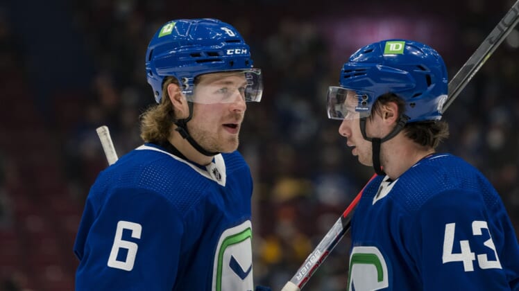 Jan 23, 2022; Vancouver, British Columbia, CAN; Vancouver Canucks forward Brock Boeser (6) talks with defenseman Quinn Hughes (43) against the St. Louis Blues in the first period at Rogers Arena. Mandatory Credit: Bob Frid-USA TODAY Sports