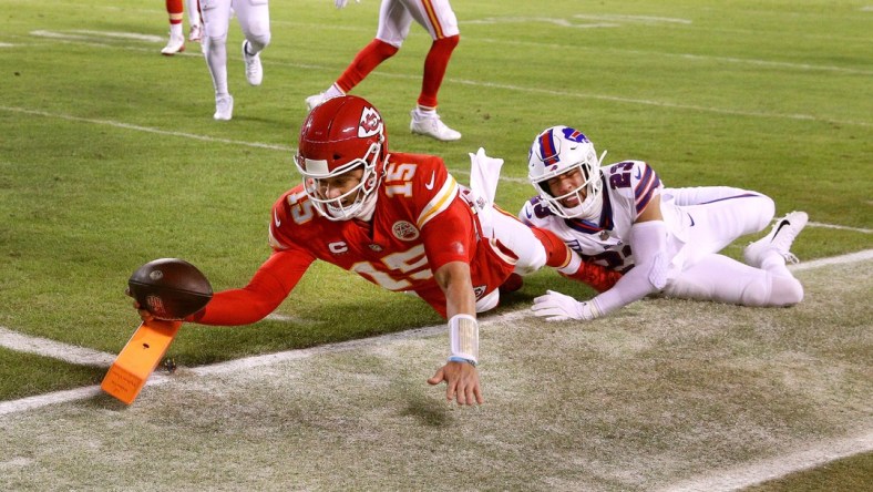 Chiefs quarterback Patrick Mahomes dives into the end zone  for an 8-yard touchdown against the Bills Micah Hyde.  The Chiefs won 42-36 in overtime.

Syndication Democrat And Chronicle