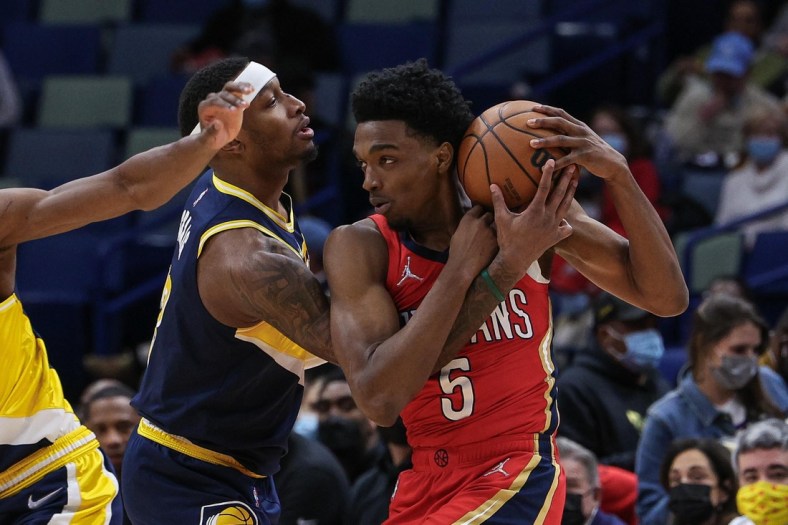 Jan 24, 2022; New Orleans, Louisiana, USA; Indiana Pacers forward Torrey Craig (13) reaches in for the ball against New Orleans Pelicans forward Herbert Jones (5) during the first half at the Smoothie King Center. Mandatory Credit: Stephen Lew-USA TODAY Sports
